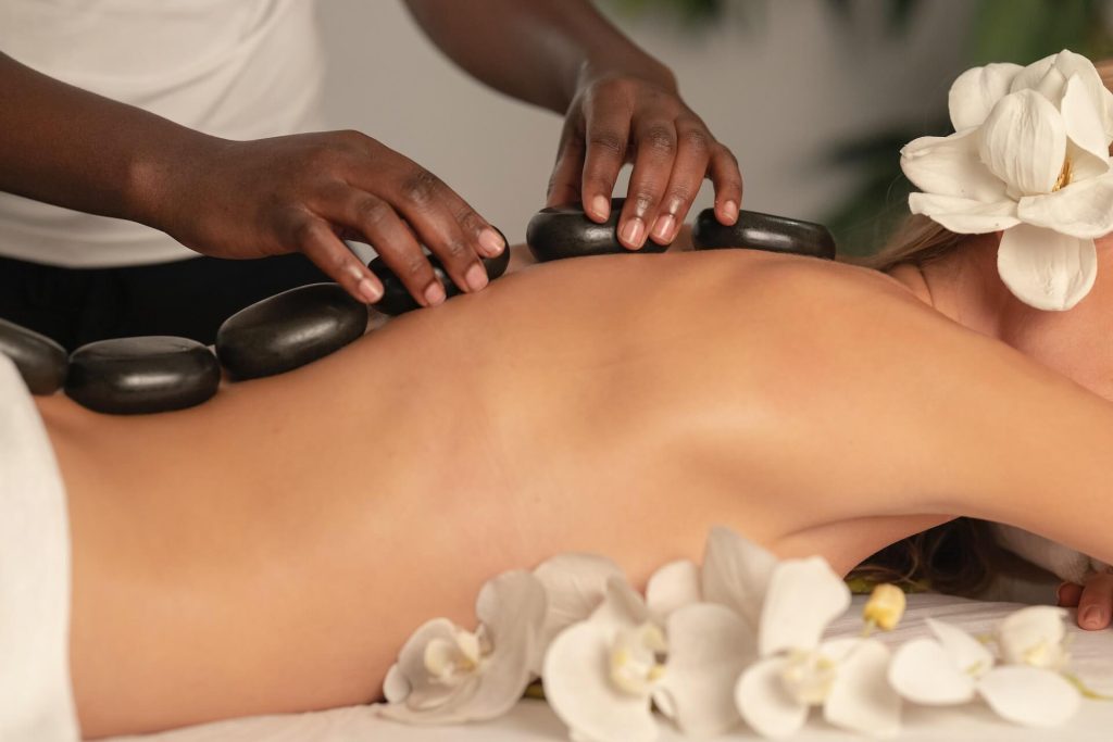 Woman Getting Stones Massage in Spa