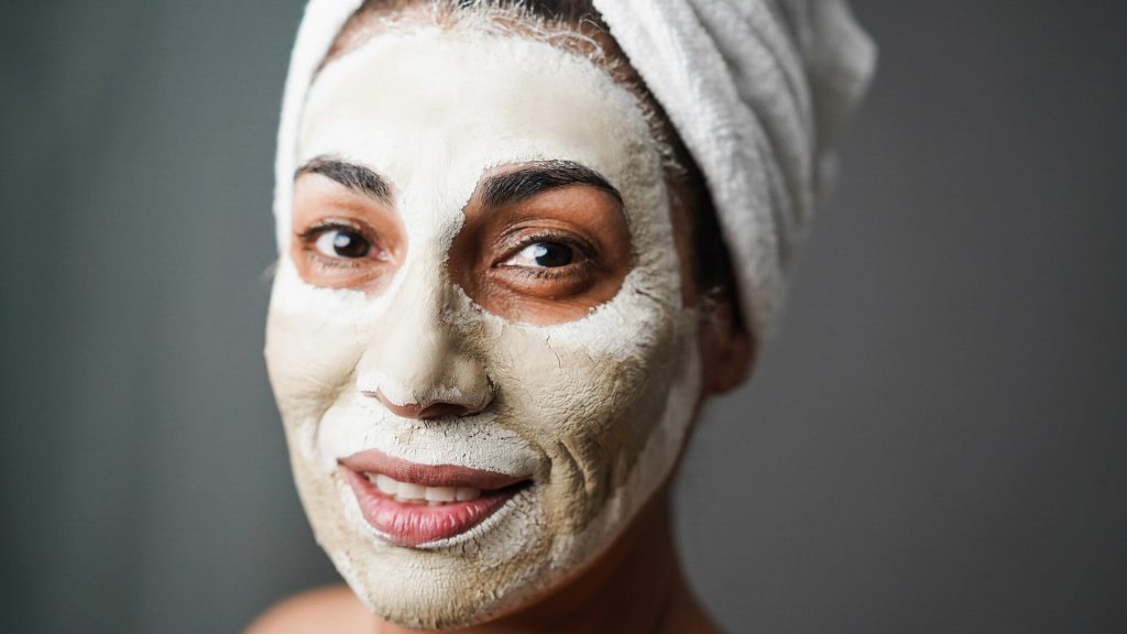 Woman doing beauty treatment using beauty skin mask